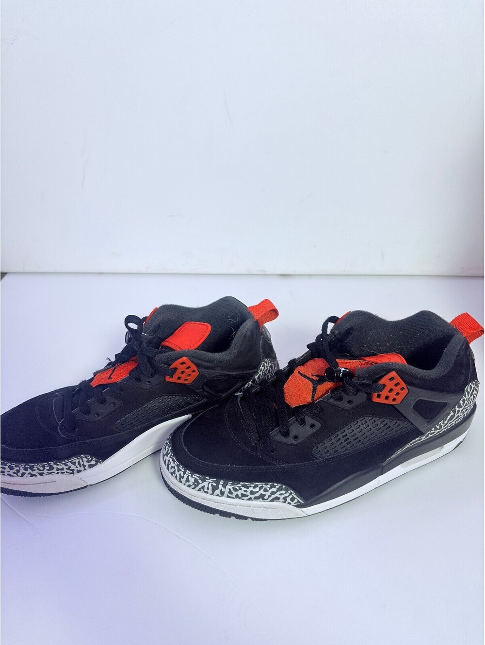 Air Jordan black sneakers with orange accents
